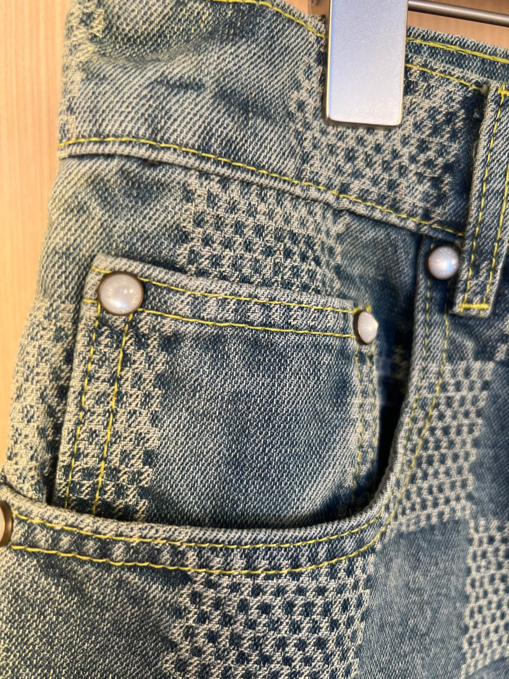Denim shorts pants front pockets with snap buttons and topstitching