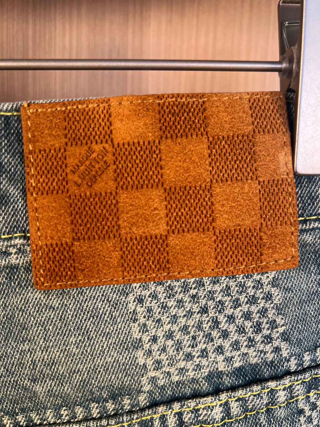 Denim shorts pants with orange check woven patch at waistband