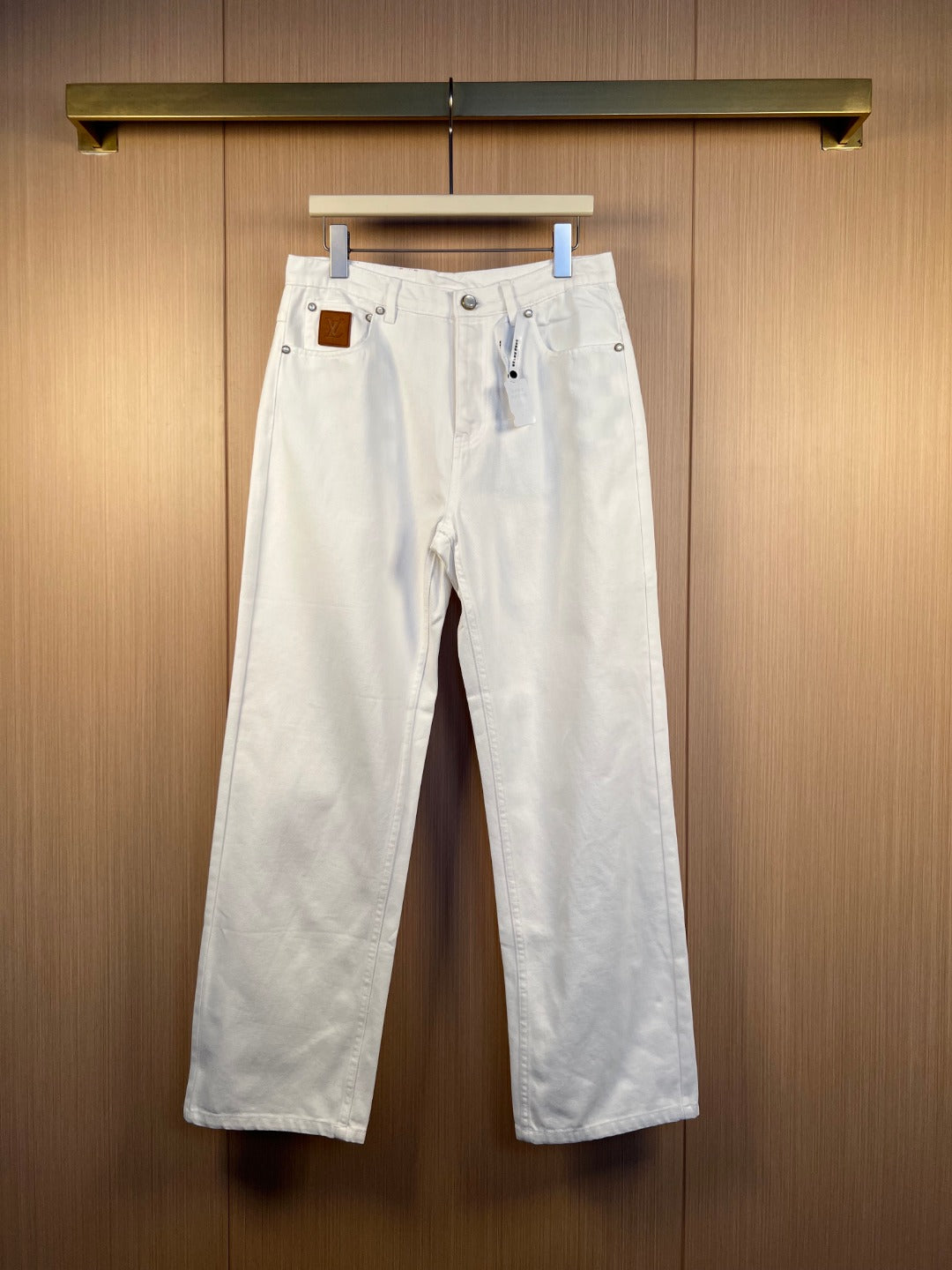 Louis Vuitton white denim pants with front button and zip closure