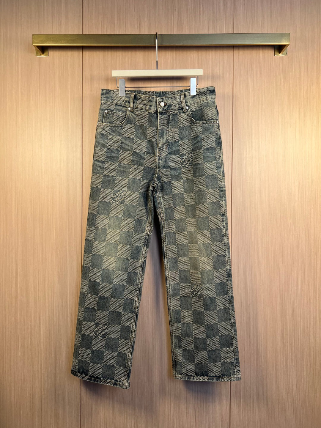 Wide-leg checkered denim pants with belt loops and metal button closure