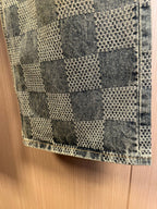Checkered denim fabric at hem with stitched side seam and cuff