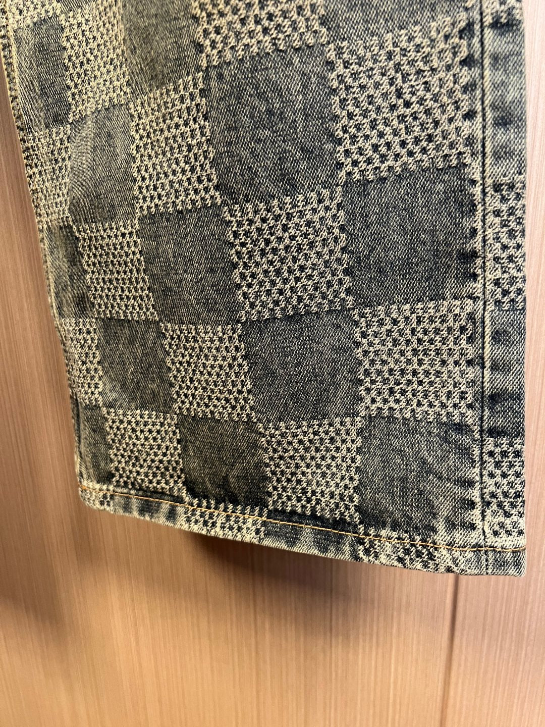 Checkered denim fabric at hem with stitched side seam and cuff