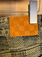 Denim waistband lining with orange check patch label holder at top