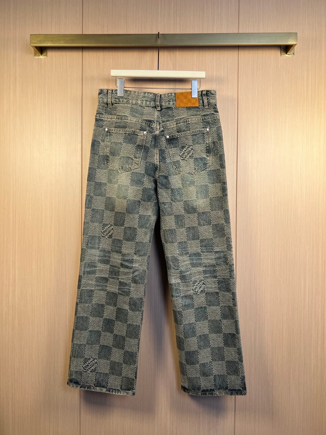 Wide-leg checkered denim pants with belt loops and metal buttons