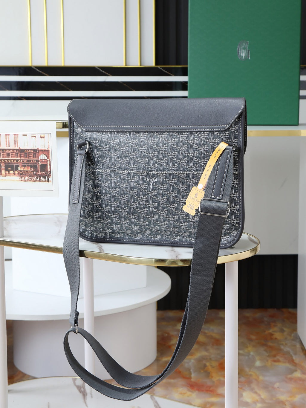 Goyard shoulder bag with front flap, dark gray trim, and single adjustable crossbody strap