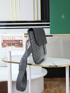 Goyard crossbody bag in dark gray monogram canvas with curved top flap and long strap
