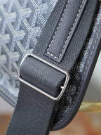 Goyard shoulder bag close-up of metal buckle and dark gray leather strap connector
