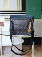 Goyard crossbody bag in dark blue with monogram canvas, top flap and adjustable strap