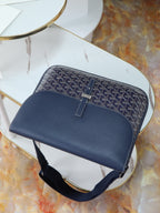 Goyard crossbody bag in dark blue monogram canvas with front strap and buckle