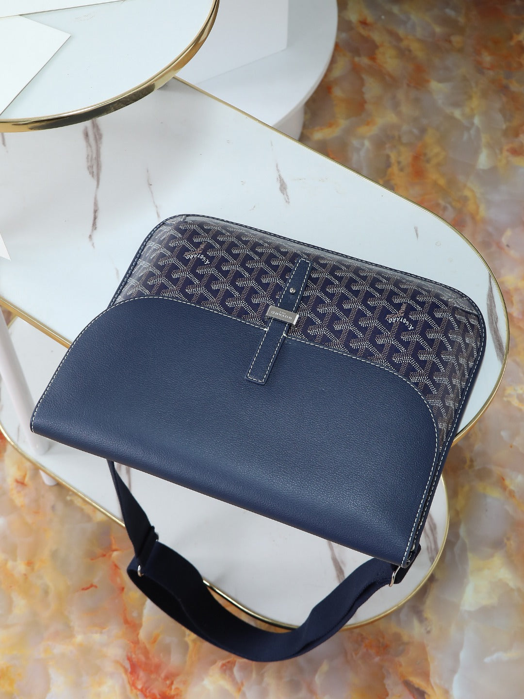 Goyard crossbody bag in dark blue monogram canvas with front strap and buckle