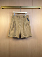 Khaki Prada shorts with belt loops, front pleats, and side pockets