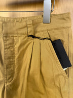 Khaki Prada shorts with button closure, belt loops, and black string detail