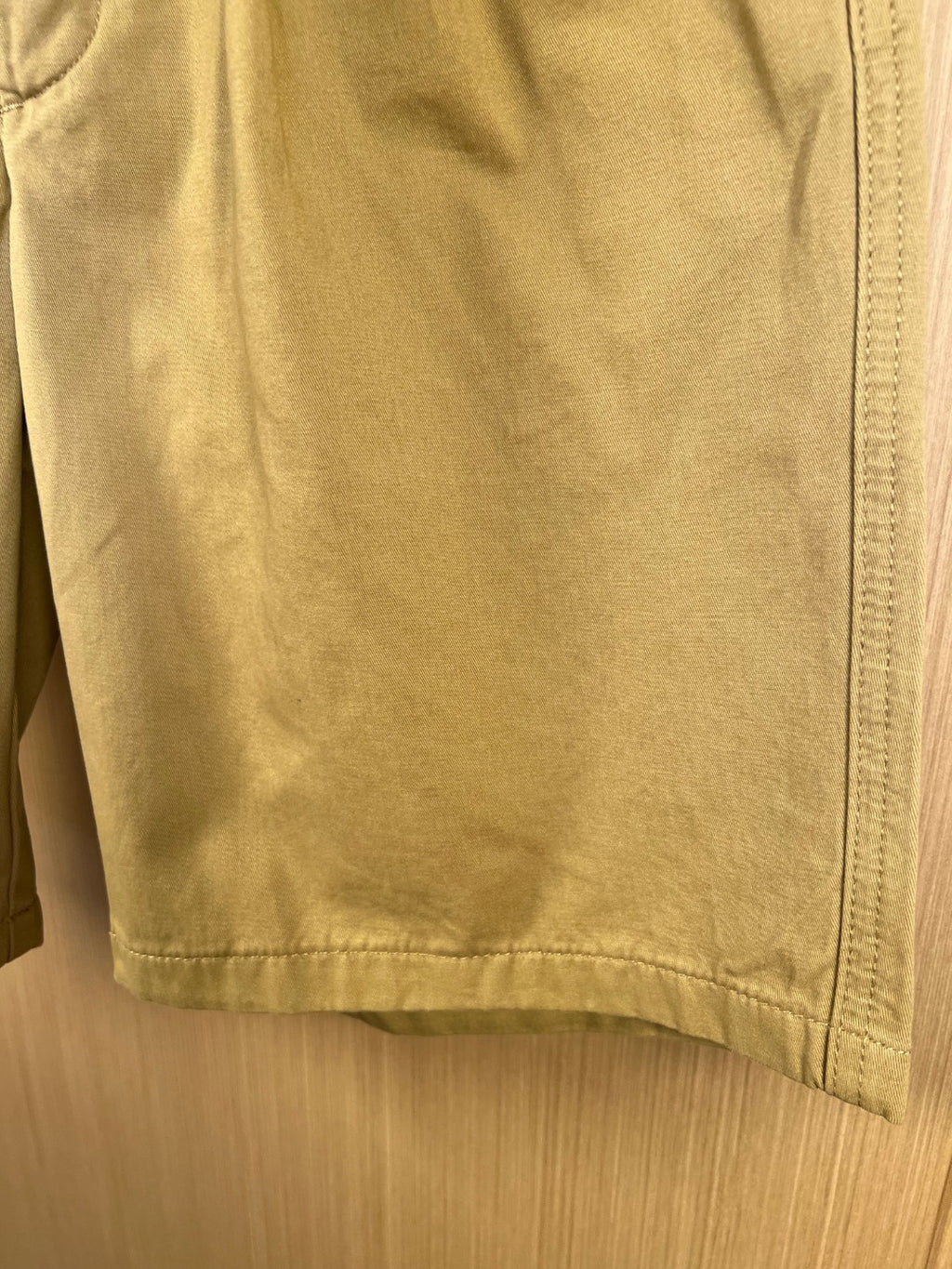 Khaki Prada shorts back panel with stitched hem and side seam