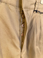 Khaki Prada shorts front with button fly and triple-button closure
