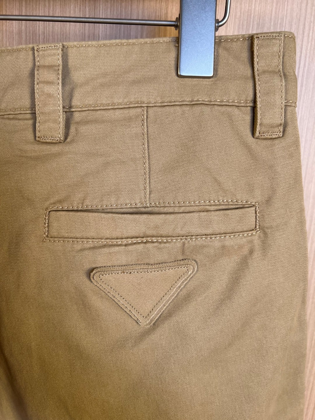 Khaki Prada shorts with flap back pocket and triangular stitched detail