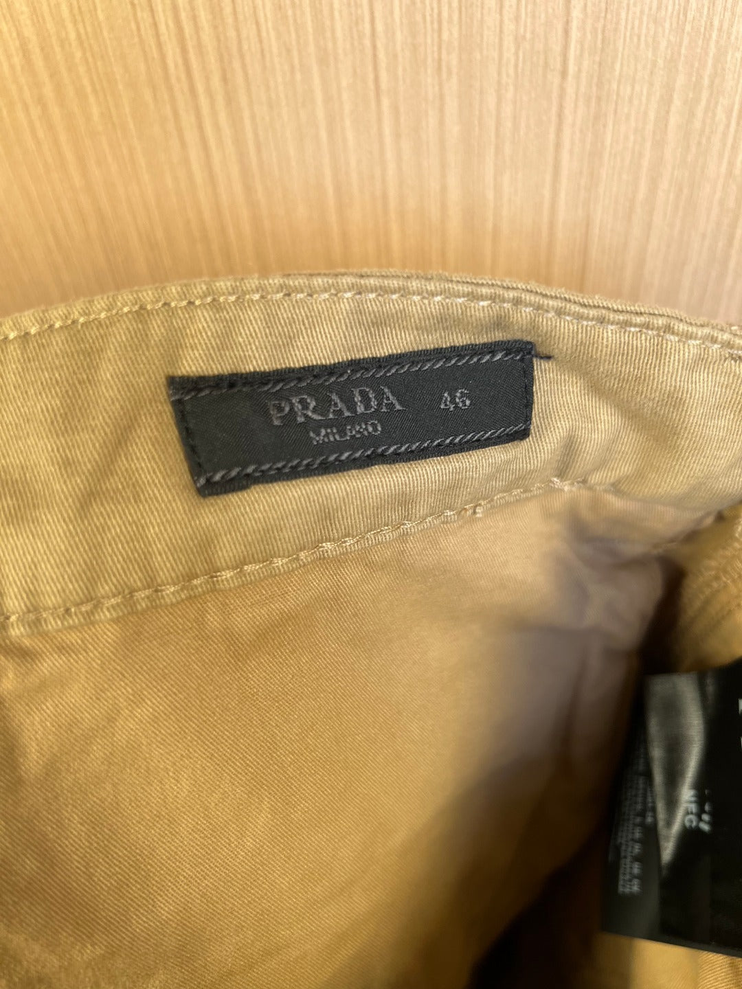 Prada logo size label inside khaki shorts