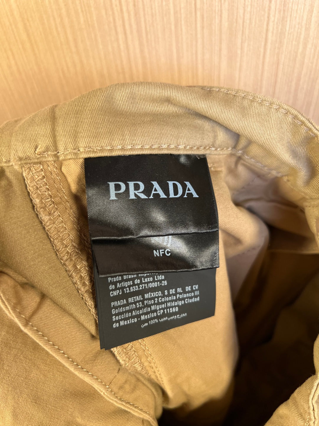 Prada NFC care label inside khaki shorts waistband