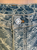 Blue denim pants close-up of waistband and interior logo patch