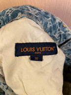 Inside waistband label reading "LOUIS VUITTON" on denim pants