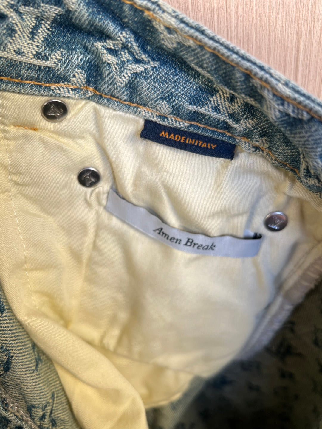 Interior care label on light denim pants with button placket detail