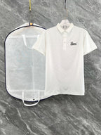 White Gucci polo shirt with short sleeves, collar, button placket, script logo