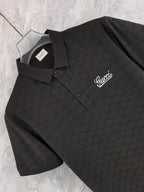 Black Gucci polo shirt close-up front, collar and button placket, script logo