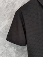 Black Gucci polo shirt side view on hanger, short sleeves and collar