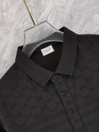 Black Gucci polo shirt neckline close-up with inner label and collar buttons