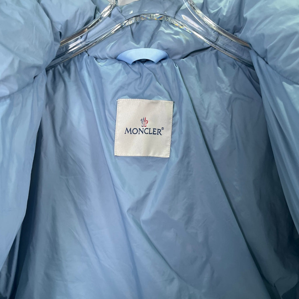 Light blue puffer jacket with inner collar label and smooth quilted lining