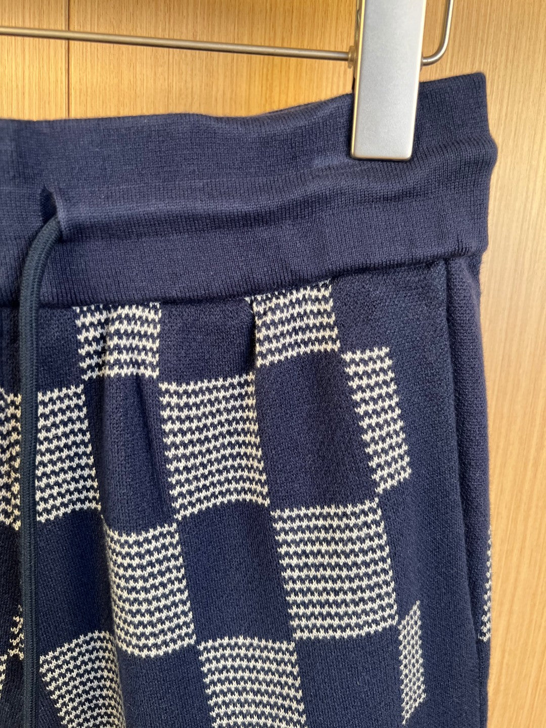 Navy shorts waistband with patchwork check fabric panels in white and cream