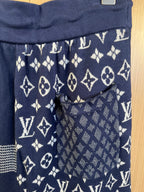 Navy shorts with allover monogram print and front pocket detail