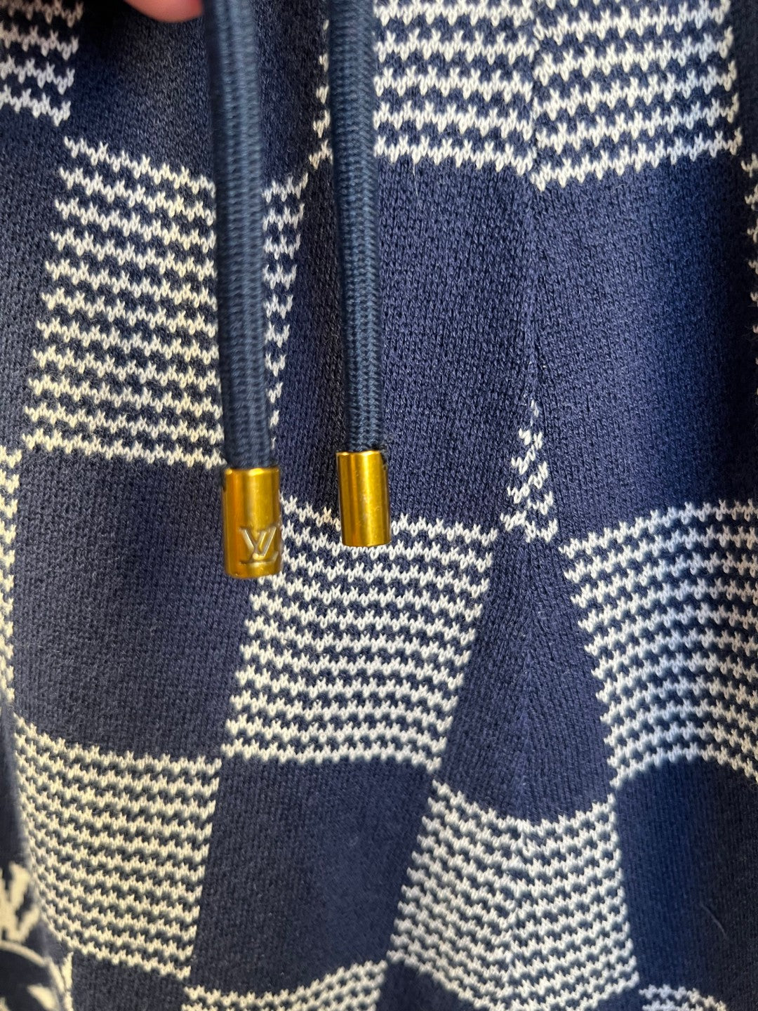 Navy shorts with check patch seams and drawcord tips, knitted fabric
