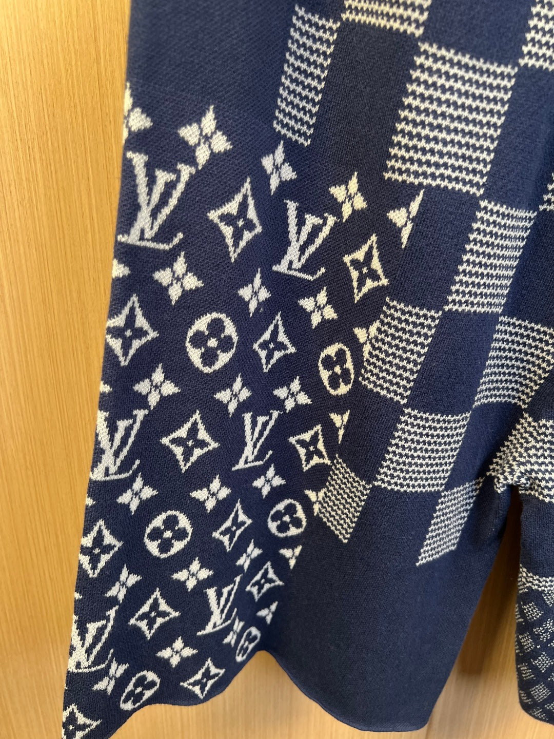 Navy shorts with monogram graphic panel and patchwork check pattern
