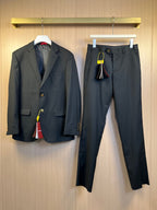 Dark blazer and trousers set with gold-tone buttons and lapels