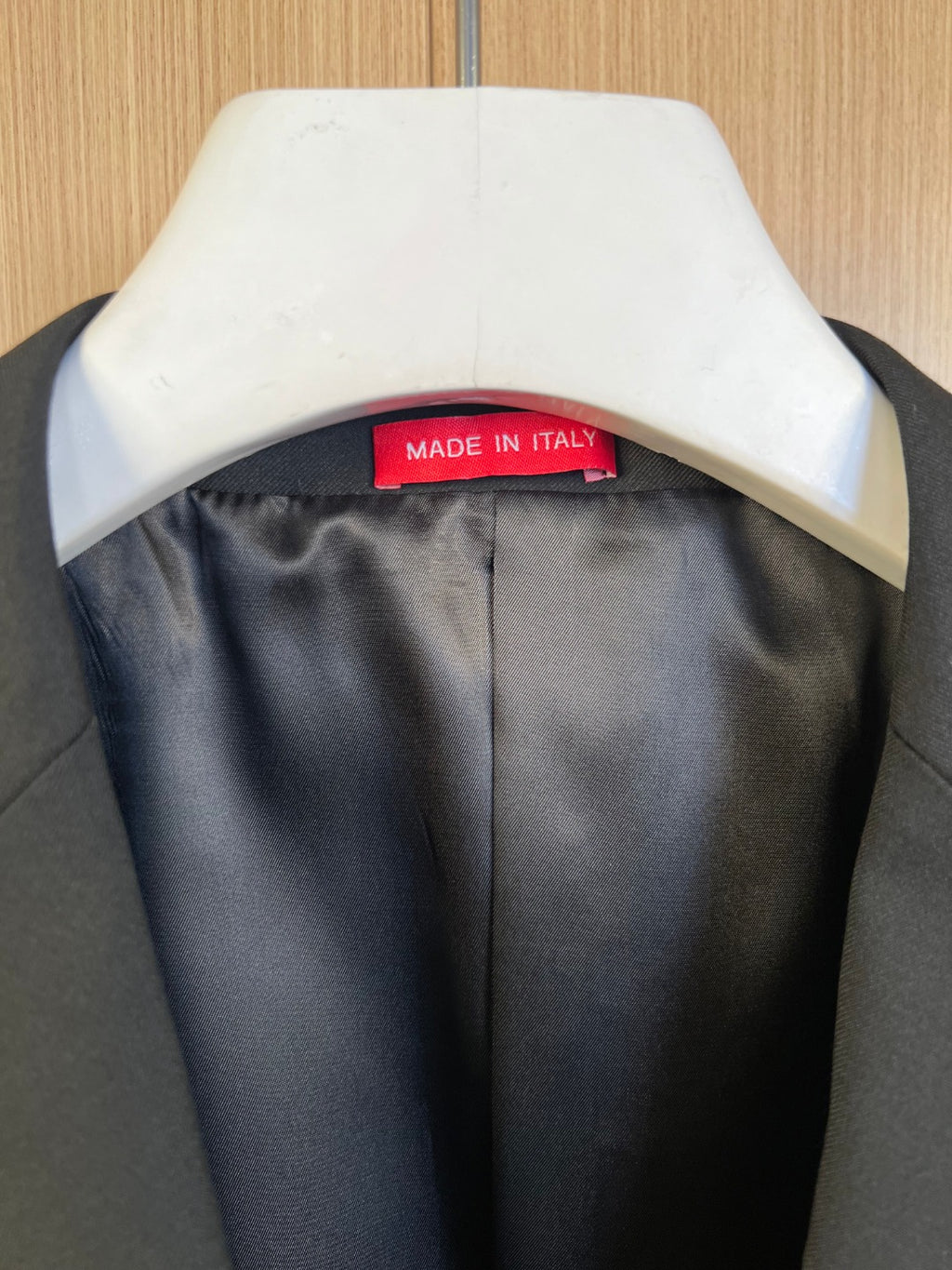 Blazer interior neck label reading MADE IN ITALY