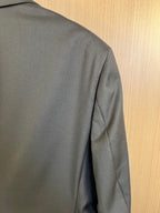 Dark long coat back panel with shoulder seam and side seam detail