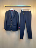 Navy Gucci suit jacket and matching trousers with button front and pockets