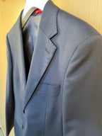 Navy blazer with notch lapel and front pocket detail