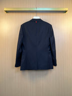 Navy suit jacket back view with center seam and buttoned neckline