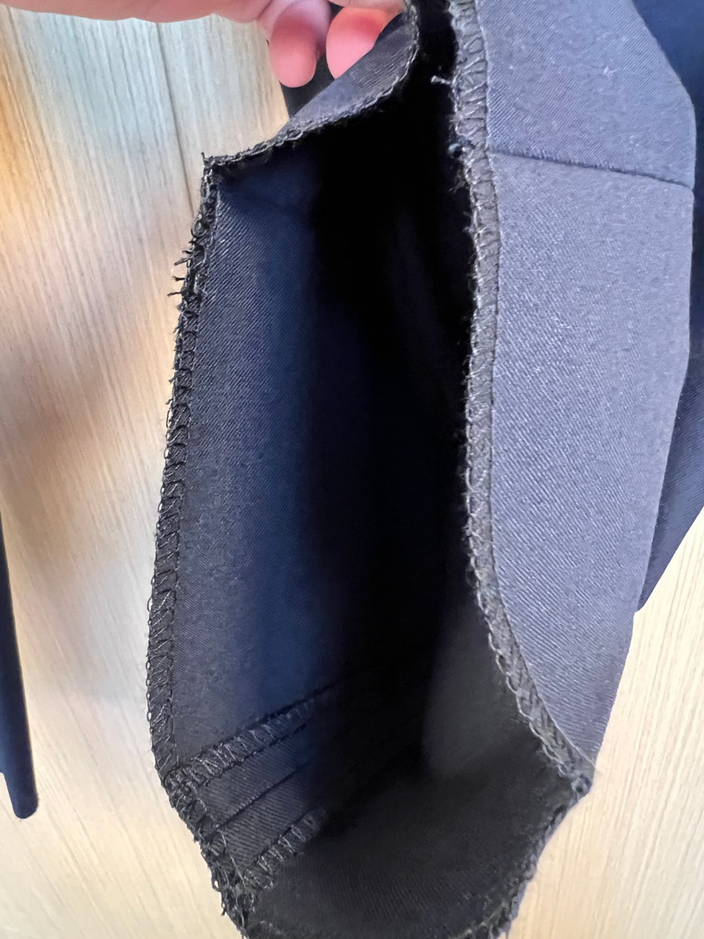 Dark navy pant leg opening with frayed cuff trim