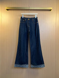 Louis Vuitton denim pants with patterned inner hem and metal button closure