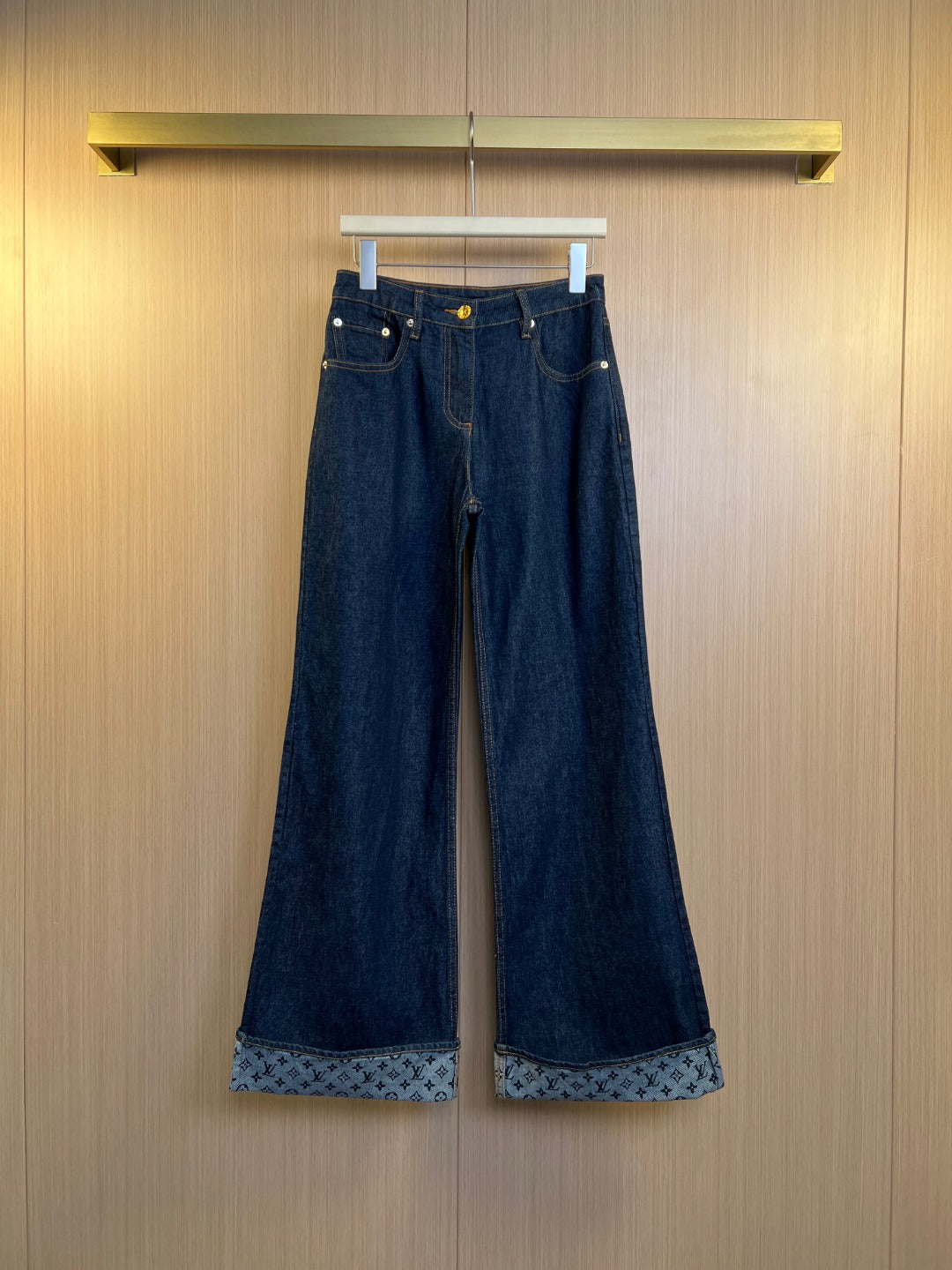 Louis Vuitton denim pants with patterned inner hem and metal button closure