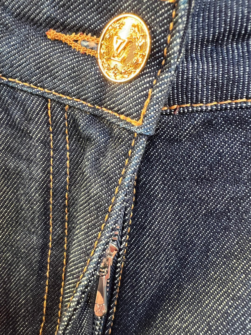 Denim pants gold-tone coin button with engraved logo and contrast stitching