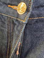 Denim pants gold-tone coin button with engraved logo and contrast stitching