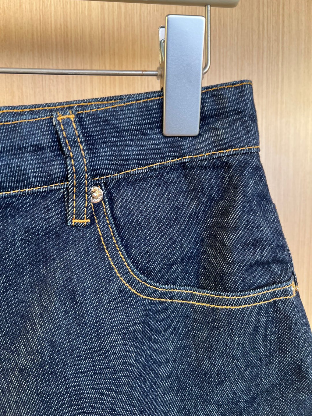 Louis Vuitton denim shorts side seam with contrast stitch and metal button