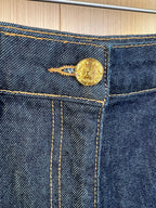 Louis Vuitton denim shorts button with gold-tone hardware and contrast stitching