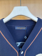 Navy knit polo shirt neckline with Louis Vuitton logo label