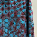 Long-sleeve shirt front with blue Gucci GG check pattern and round buttons