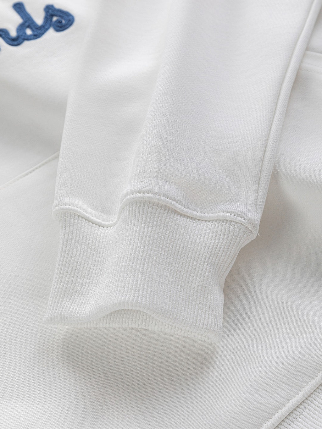 White Dior hoodie sleeve cuff with ribbed knit trim