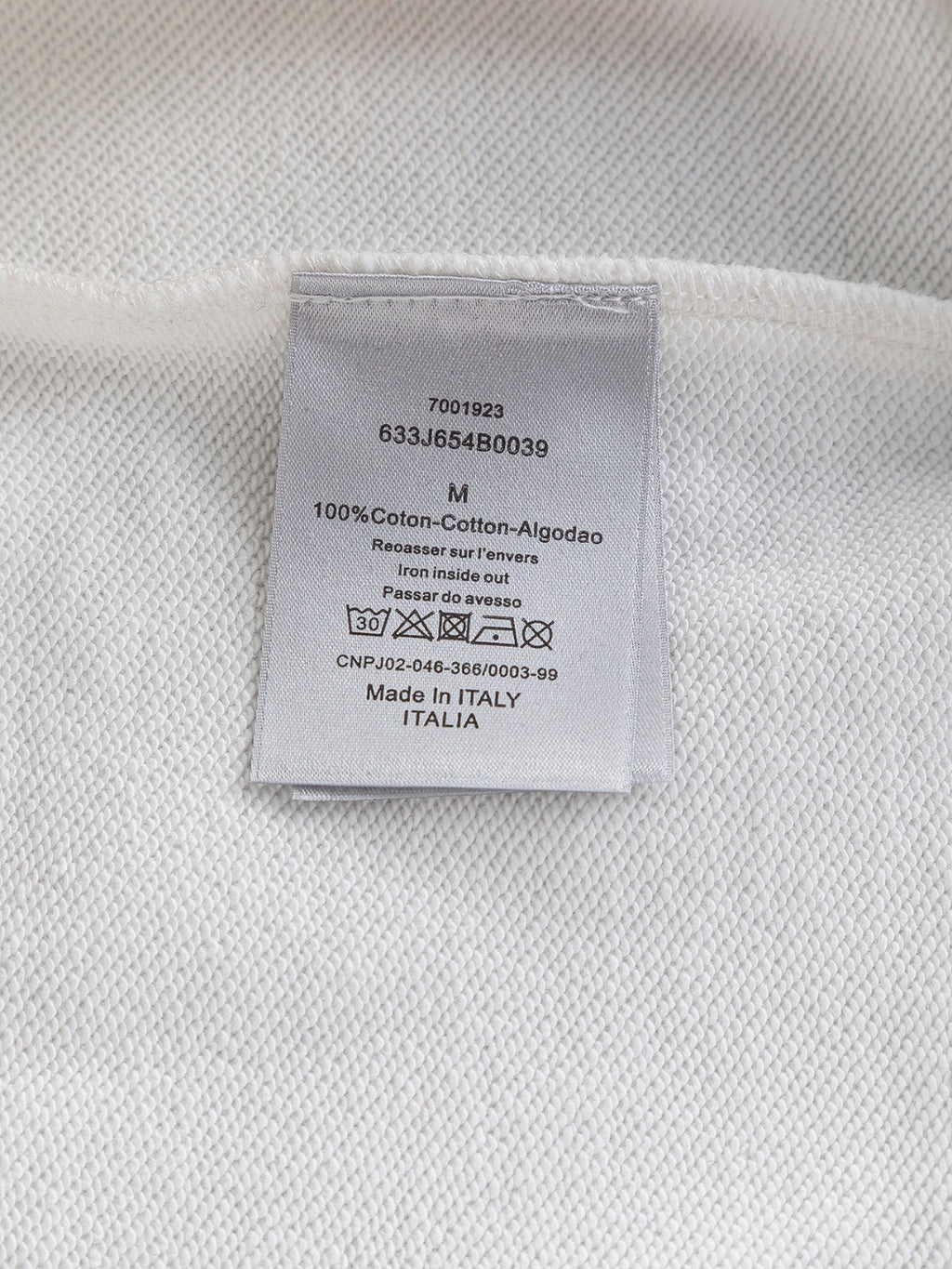 Dior hoodie care label tag with fabric info and Made in Italy